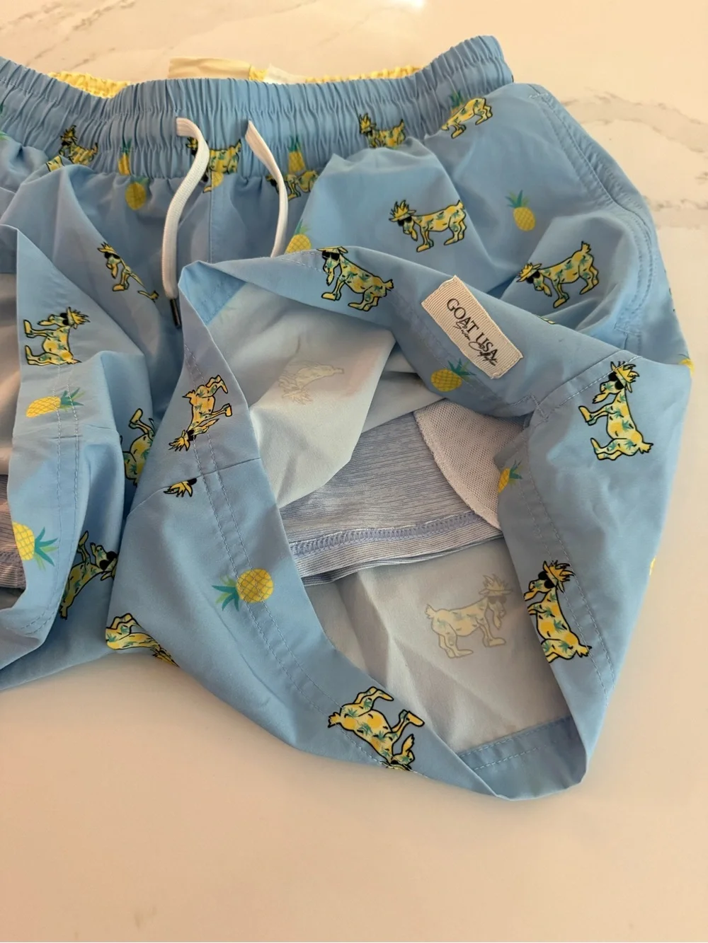 Men's Light Blue Pineapple & Goat Print Swim Trunks